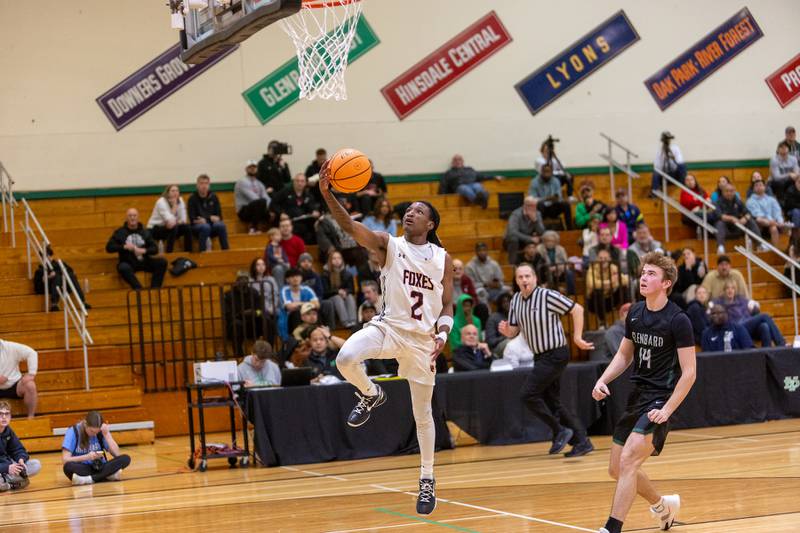 Yorkville's Alon Flint goes in for the layup against Glenbard West on Friday Dec. 26,2025 at the 51st. Annual Jack Tosh Holiday Tournament in Elmhurst.