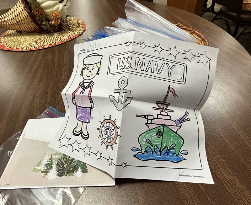 Cards and photos created by adults and children were part of care packages for sailors on the USS Fitzgerald at the Evangelical Free Church of Mt. Morris  on Thursday, Oct. 16, 2025.