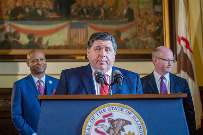 Gov. JB Pritzker is pictured in his Capitol office with fellow Democrats House Speaker Emanuel “Chris” Welch and Senate President Don Harmon at a news conference announcing a fiscal year 2024 budget plan in May 2023. Nearly halfway through the fiscal year, the governor’s budgeting office is now projecting a $1.4 billion surplus.
