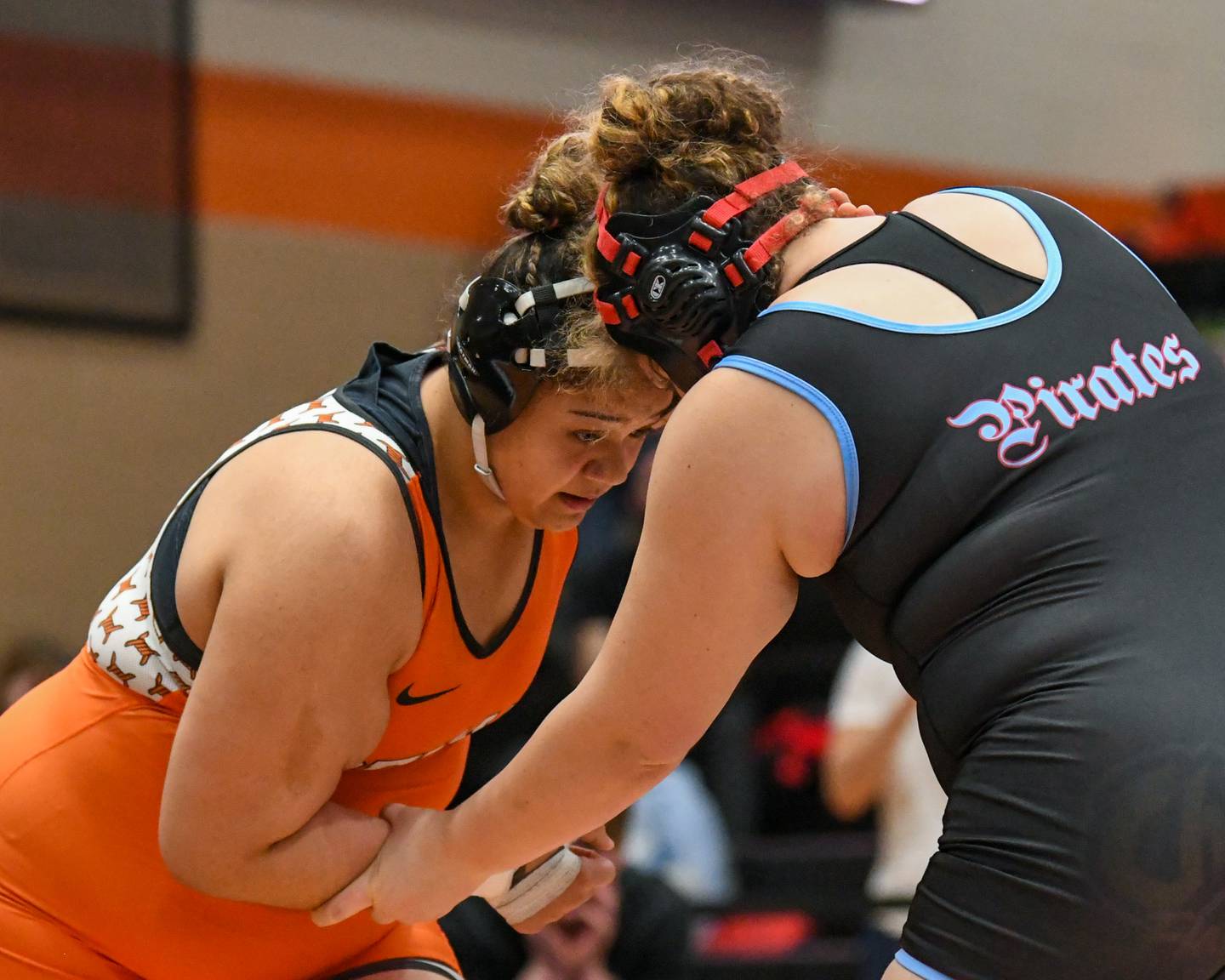 Wrestler Aarianna Bloyd of DeKalb, left, goes head-to-head with Ottawa Township wrestler’s Juliana Thrush during the 235-pound weight class championship match up on Saturday Feb. 14, 2026, held at DeKalb High School.