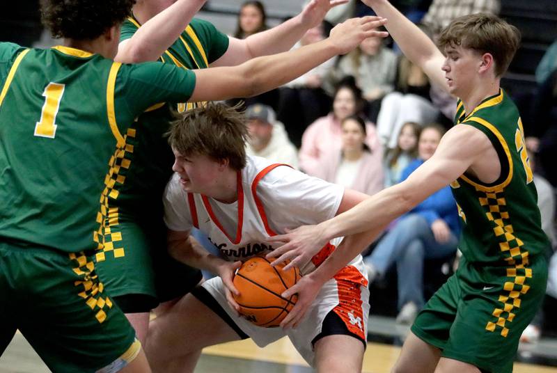 McHenry’s Nathan Ottaway battles through heavy Crystal Lake South traffic in varsity boys basketball on Friday, Feb. 20, 2026, at McHenry High School in McHenry.