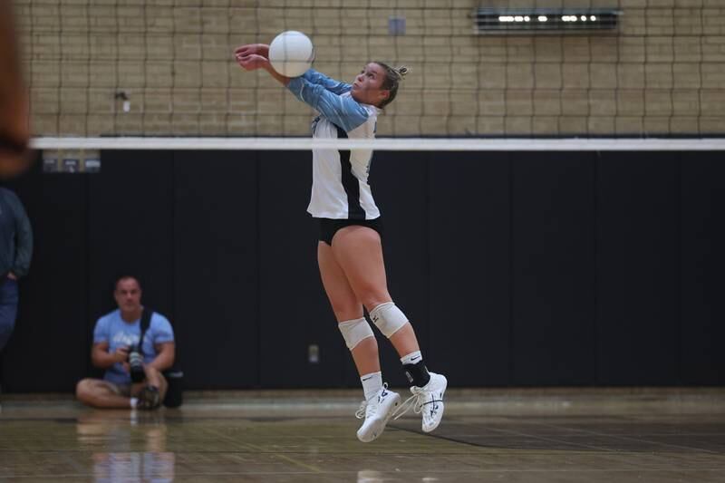 Joliet Catholic’s Allie Wuestenfeld receives a serve against St. Laurence during the Class 3A Hinsdale South Super-Sectional match.