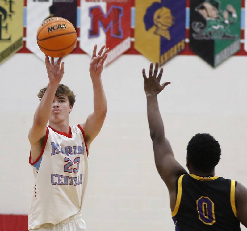 Marian Central's Finn Pivnicka shoots the ball over Chicago Christian's Kerry Teague during a Chicagoland Christian Conference basketball game on Tuesday, Jan. 21, 2025, at Marian Central High School.