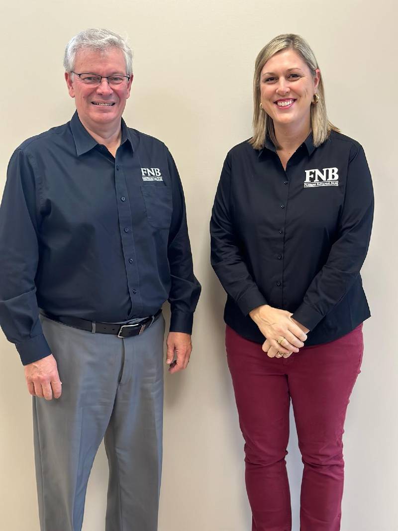 Kim Gehling (right) has been appointd to the Farmer National Bank Board of Directors. Here she is show with FNB President and CEO Garett Plumley.