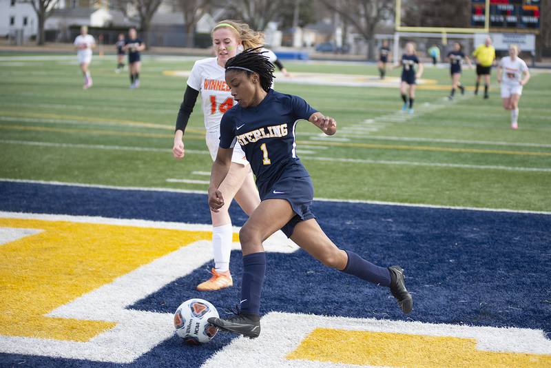 Sterling's Taah Liberty drives to the goal against Winnebago on Thursday, March 17, 2022.