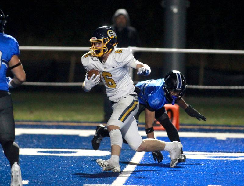 Sterling’s Jimmy Wadsworth carries the ball during a Class 5A first-round game against Sterling on Friday, Nov. 1, 2024 in Wheaton.