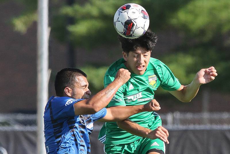 DeKalb County United's Oscar Montejano (right) heads the ball away from Rockford FC’s Erik Manriquez during their game Saturday, July 29, 2023, at the Soccer & Track and Field Complex at Northern Illinois University in DeKalb.