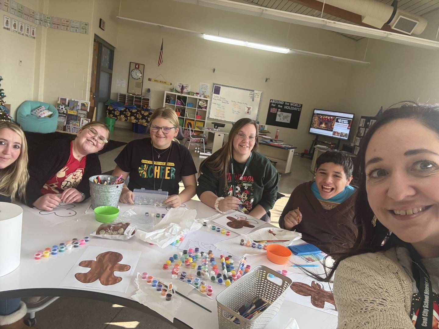 Gina Pens, a 2026 Shaw Local Everyday Hero (far left) is seen with students from the classroom of Angela Roudis (far right), a sixth-to eighth-grade teacher in the Cross-Categorical program at Coal City Middle School, where Pens works as a paraprofessional.