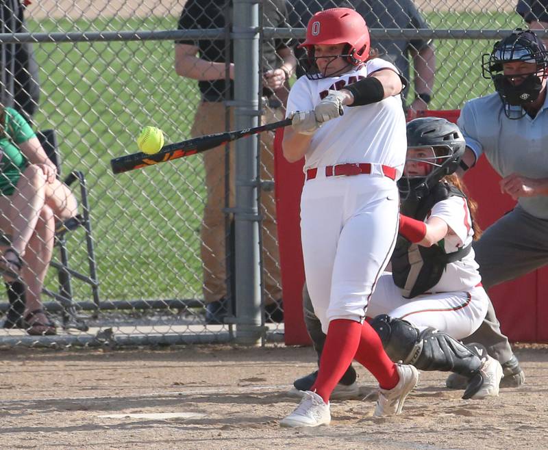 Ottawa's Kendall Lowery gets a hit against L-P on Friday, April 14, 2023 at Ottawa High School.