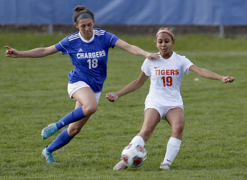 Dundee-Crown's Berkley Mensik tries to get to the ball in front of Crystal Lake Central's Chelsea Iles during a Fox Valley Conference soccer match Tuesday April 26, 2022, between Crystal Lake Central and Dundee-Crown at Dundee-Crown High School.