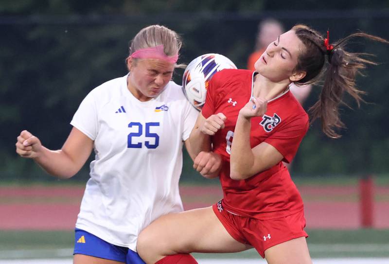 Johnsburg's Jacquelyn Douglas (left) and Timothy Christian's Avery Croff go up for a header Thursday, June 5, 2025, during their IHSA Class 1A state semifinal at North Central College in Naperville.