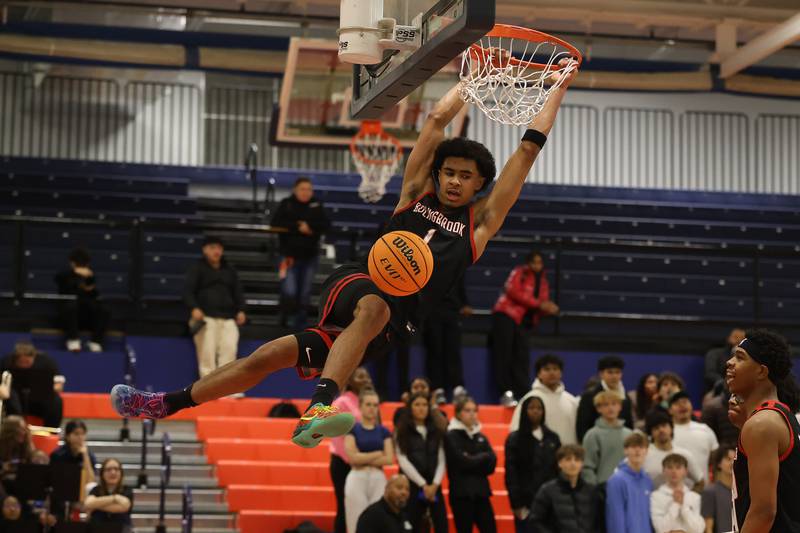 Bolingbrook's Brady Pettigrew throws down a dunk against Romeoville on Tuesday, Dec. 2, 2025 in Romeoville.