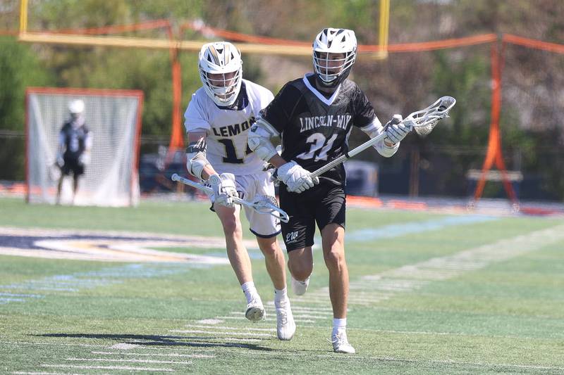 Lincoln-Way’s Gavin Vasquez heads up field with the ball against Lemont on Saturday, April 25, 2026 in Lemont.