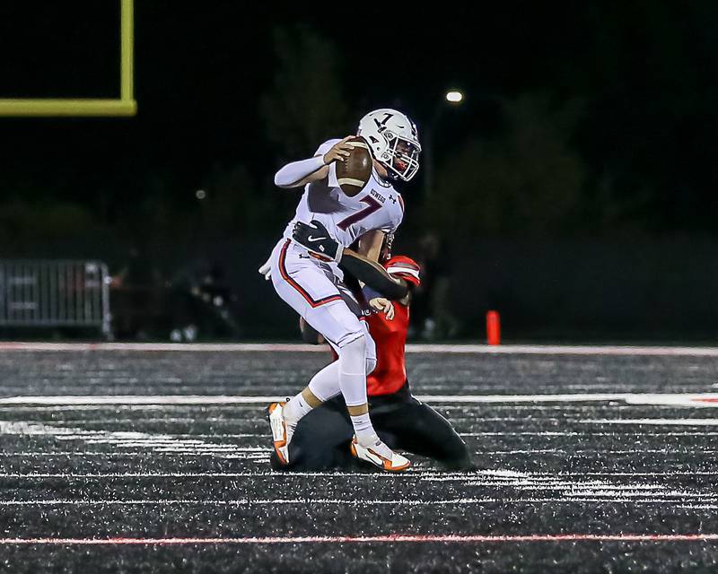 Oswego's Brett Connolly (7) is sacked during a football game between Oswego at Bolingbrook on Friday, Oct 4th, 2024  in Bolingbrook.