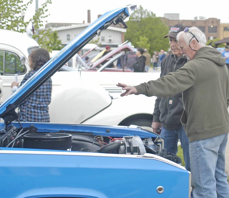 Dan Kinnman of Hanover and Brad Kruse of Dixon look over a '68 Dodger Polara. Sterling Main Street's 12th Annual Car Show took place at the Sterling Marketplace on Sunday, May 4th, 2025.
