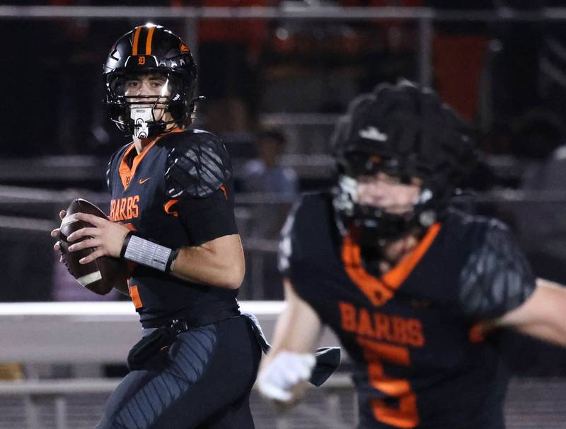 DeKalb's Cole Latimer looks for receiver Lukas Stubblefield during their game against Andrew Friday, Oct. 16, 2025, at DeKalb High School.