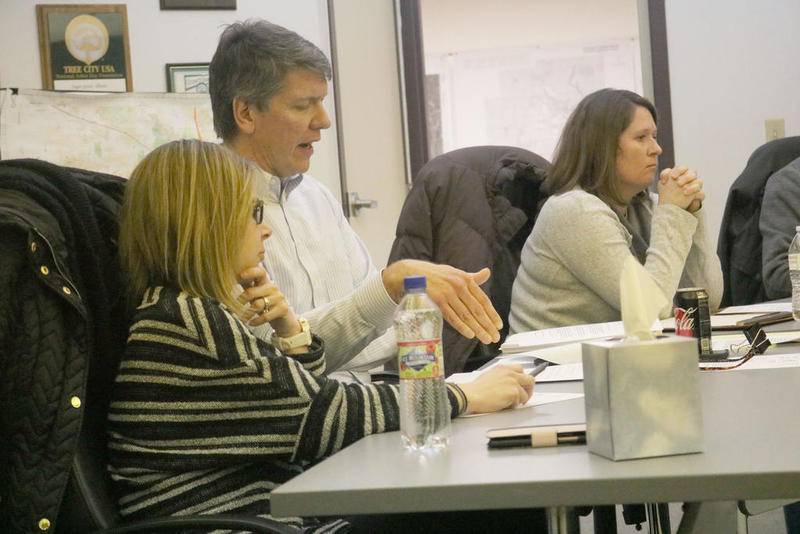 Village Administrator Brent Eichelberger (center) speaks out during the Sugar Grove Village Board's Jan. 21 meeting.