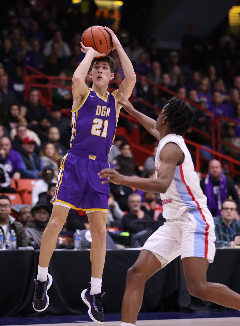 Downers Grove North's Jack Stanton (21) takes a shot during the boys 4A super-sectional game between Kenwood Academy and Downers Grove North high school in Chicago on Monday, March 6, 2023.