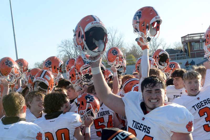 Byron players celebrate after their win over Lombard-Montini in 3A football semifinals in Lombard on Saturday, Nov. 18, 2023.