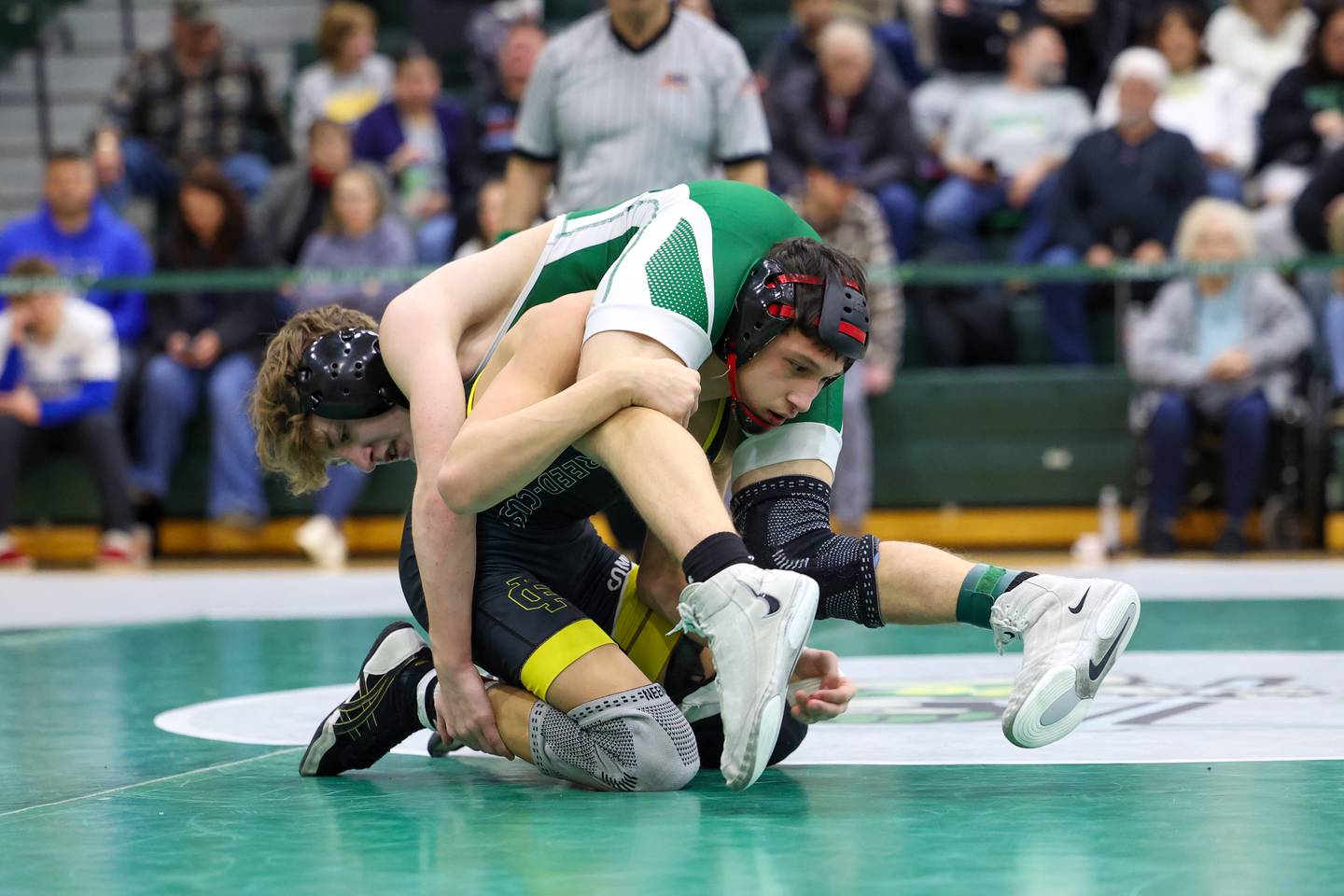 Reed-Custer's Colton Drinkwine and Coal City's Gavin Roudis, top, wrestle in the 113-pound championship match during the IHSA Class 1A Coal City Sectional on Saturday, Feb. 14, 2026.