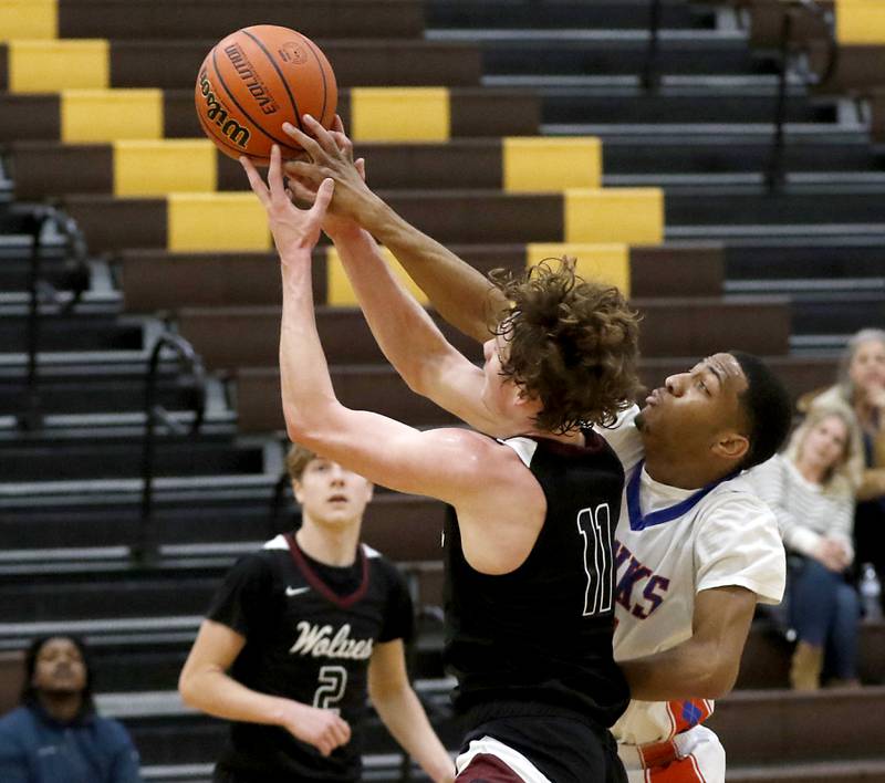 Hoffman Estates’ Kentrell Brance knocks the ball away from Prairie Ridge's James Muse during a Hinkle Holiday Classic basketball game Wednesday, Dec. 28, 2022, at Jacobs High School in Algonquin.