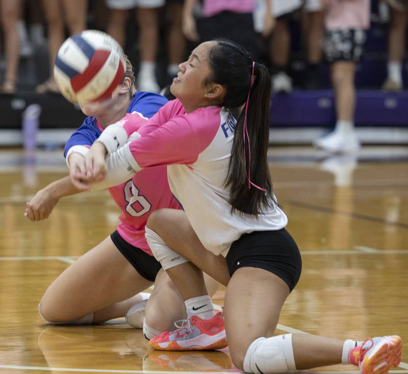 Dixon’s Micki Worrell (left) and Yui Santos go after a ball against Newman Thursday, Oct. 2, 2025.