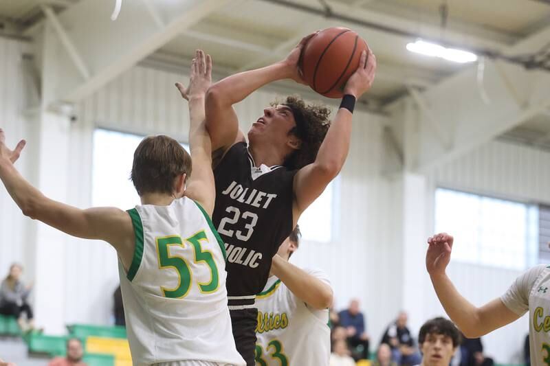 Joliet Catholic’s Jake Troyner battles for a shot against Providence on Saturday, Dec. 9th, 2023 in New Lenox.