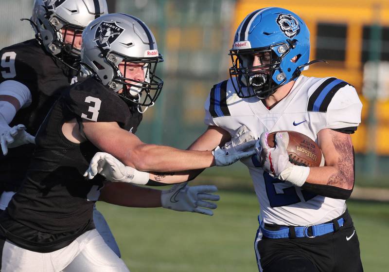 Lake Zurich's Chris Pirrone tries to fend off Kaneland's Michael Layne on Saturday, Nov. 4, 2023, during their Class 6A second-round playoff game at Kaneland High School in Maple Park.