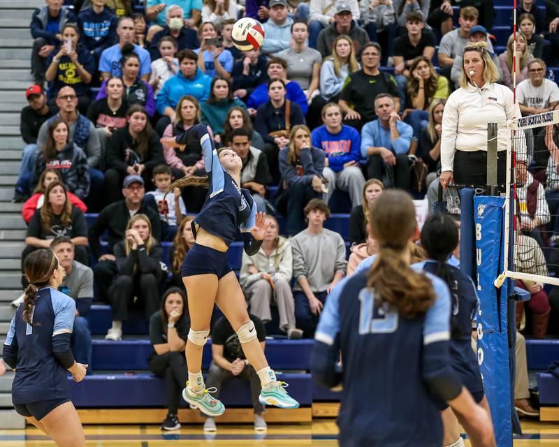 Downers Grove South's Jayda Dixon (9) leaps high for a spike during Class 4A Riverside-Brookfield Supersectional match between Lockport at Downers Grove South.  Nov 11, 2024  in Riverside.