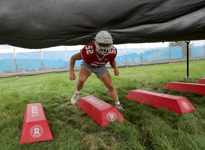 Marian Central’s Dan French runs through a rushing drill during football practice on Tuesday, August 19, 2025, at Marian Central  High School in Woodstock.