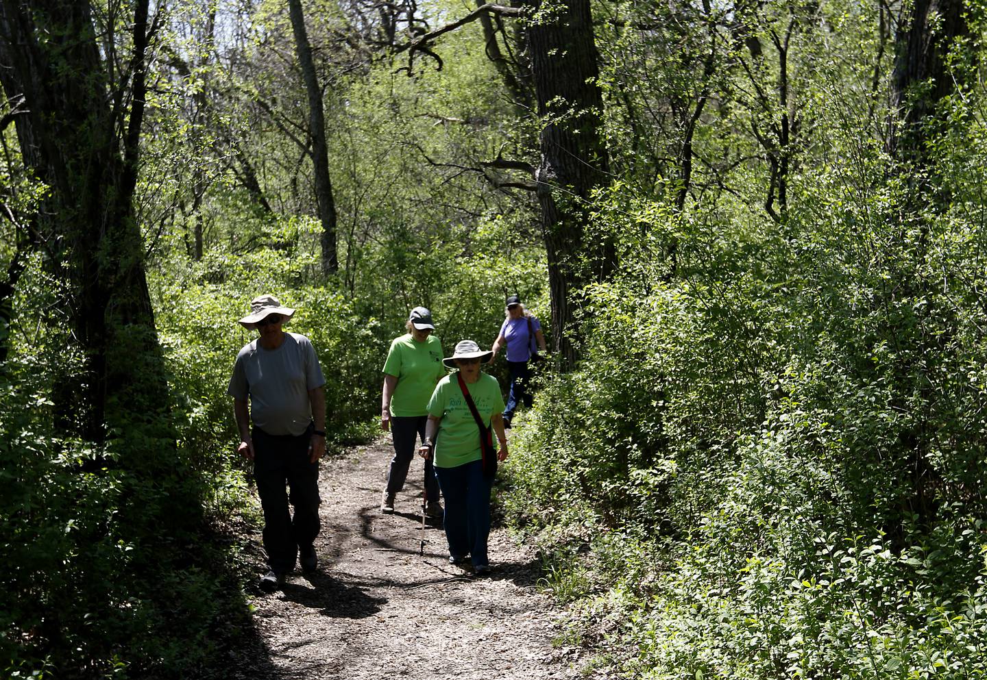 John Scheider, Donna Quinlan, Valerie Koehn, and Val Oldenburg hike Wednesday, May 10, 2023, at the Boone Creek Conservation Area in Bull Valley.