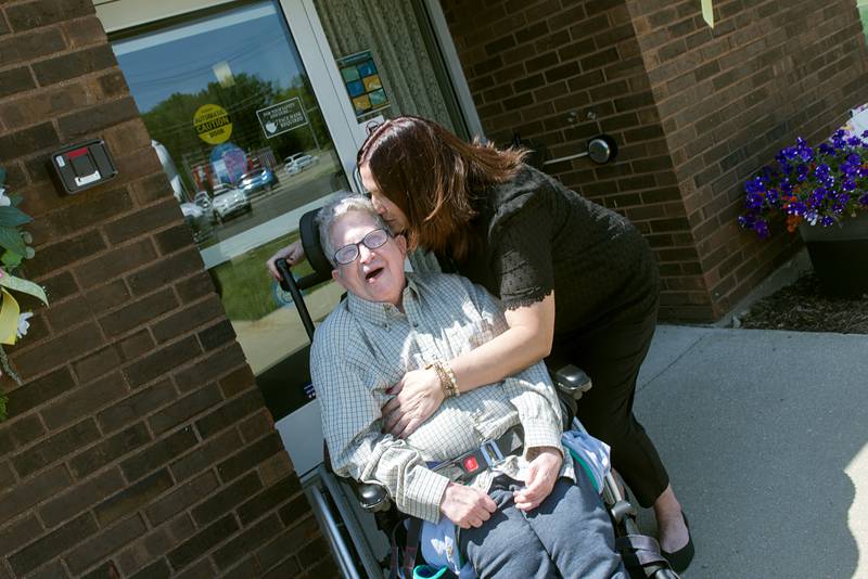 Exceptional Care director Melissa Francque gives long time longtime resident Ronnie Coon a kiss at the Sterling facility. The assisted living home is looking to build a new facility on the northwest part of Sterling.