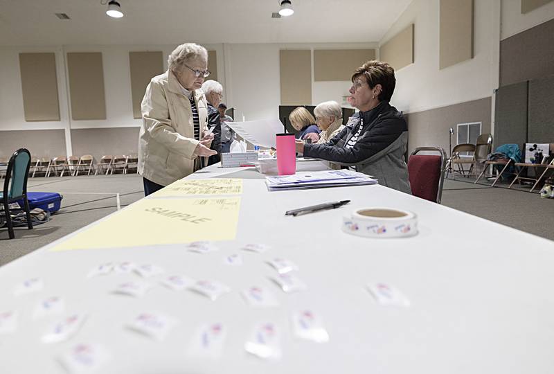 Deb Heller (right) hands Mildred Hodapp a ballet Tuesday, Nov. 8, 2022 at Northside Baptist Church in Dixon.