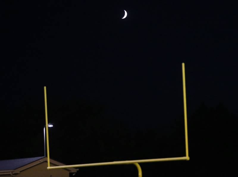 A half moon splits the upright of the goal post on Friday, Sept. 26, 2025 at Gould Stadium in Ottawa.