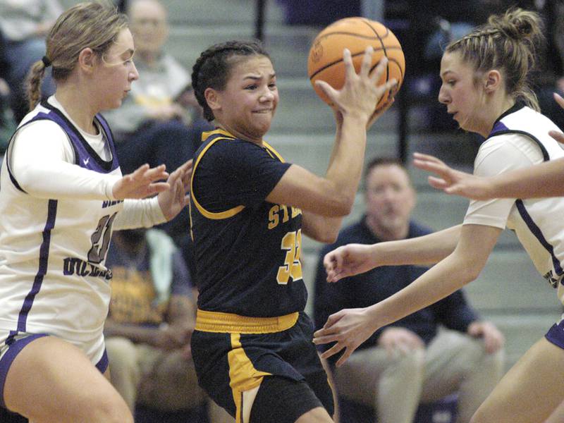 Sterling player Joslynn James fights through traffic.   Dixon and Sterling girls basketball teams played in the 3rd place game of the Dixon Girls KSB Holiday Basketball Classic Saturday, Dec. 28, 2024.