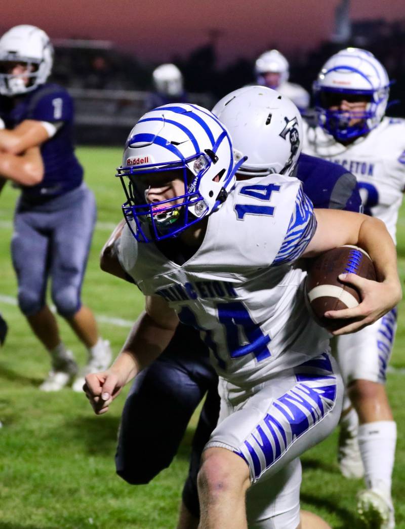 Princeton quarterback Will Lott pushes ahead at Monmouth-Roseville Friday night. The Tigers won 40-0.