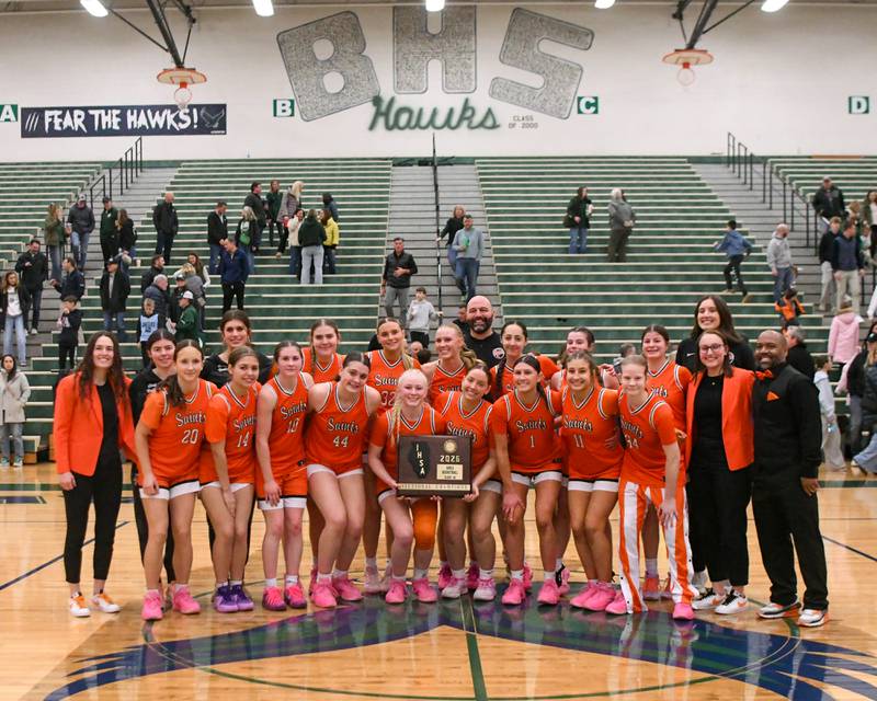 St. Charles East girls’ basketball team poses for a photo after securing a win over Glenbard West in the 4A Sectional championship game on Thursday Feb. 26, 2026, held at Bartlett High School.