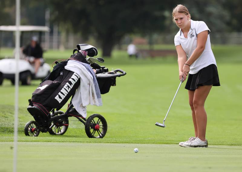 Kaneland’s Braelyn Davoust putts on the 18th green Thursday, Sept. 28, 2023, during the Class 2A girls golf regional at Sycamore Golf Club in Sycamore.