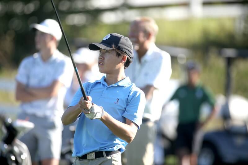 Oswego East’s Logan Hong tees off during the Class 3A Plainfield North Boys Golf Sectional at Whitetail Ridge Golf Course in Yorkville on Monday, Oct. 2, 2023.