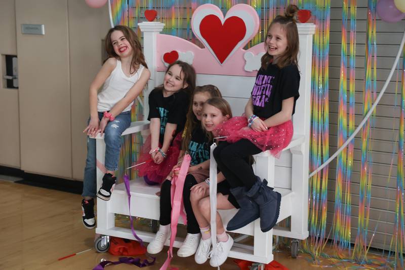 A group of Swifties get their photo taken at the Taylor Swift fan party hosted by the Lockport Township Park District on Saturday, Feb. 10, 2024 in Lockport.