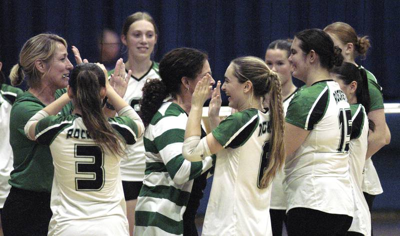 Rock Falls' players and coached celebrate following a win. Rock Falls took on Sherrard in the Class 2A regional volleyball semifinal Tuesday, Oct. 29, 2024 at Newman High School.