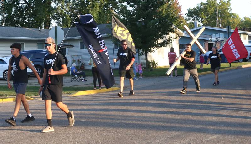 A religous group walks during the inaugural Homecoming parade on Wednesday, Sept. 17, 2025 down Elm Street in Granville.