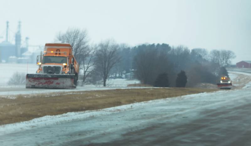 Two Illiinois Department of Transportation trucks plow and apply salt on Illinois 2 between Dixon and Sterling on Wednesday, Feb. 12, 2025.