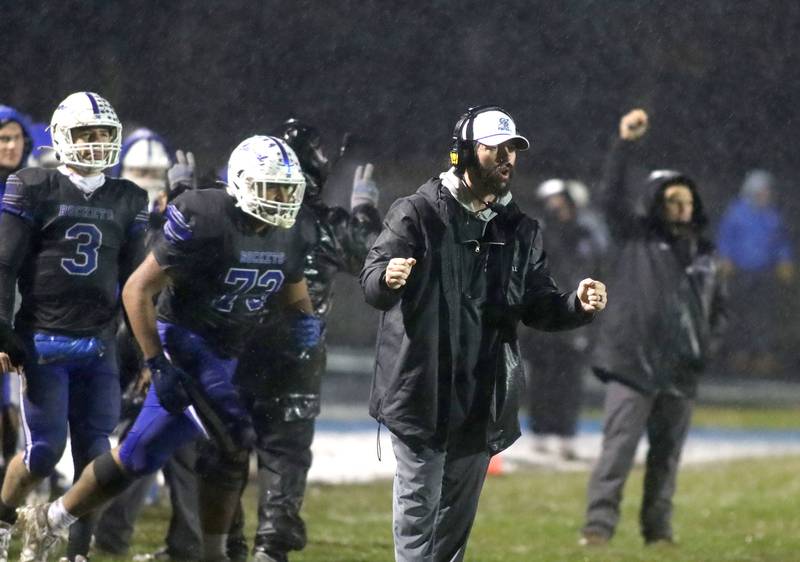 Burlington Central’s players and coaching staff react during win against Harlem in IHSA football Class 6A second-round playoff action at Central High School in Burlington on Saturday, November 8, 2025.