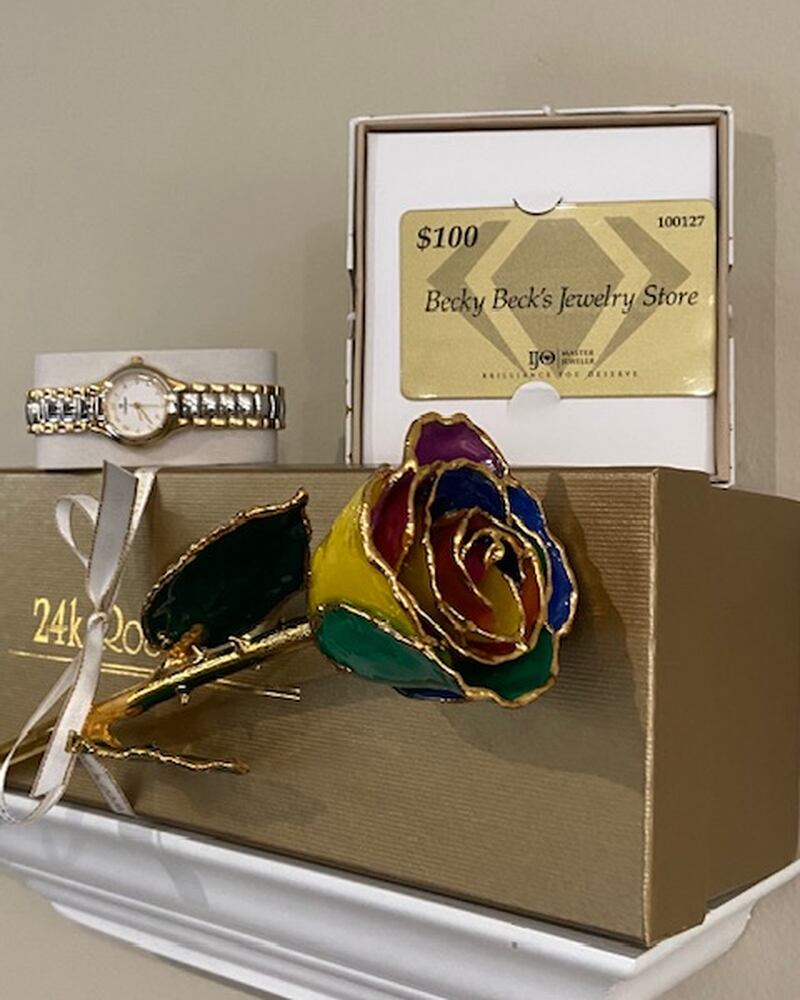 Raffle prizes include a special gift combination including a beautifully enameled rose, a gift card, and a ladies watch from Becky Beck’s Jewelers, or a basket full of comfy treats, compliments of Ellen Rogers and Kate Madeley.