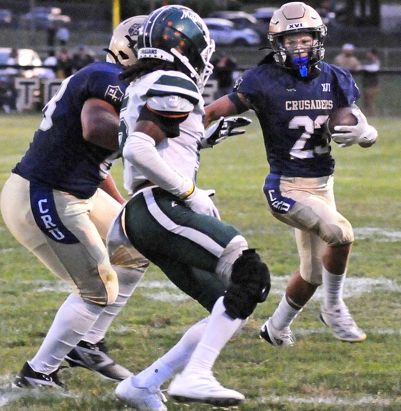 Marquette’s Jacoby Gooden looks for an opening on a run in the 1st quarter Friday at Marquette.