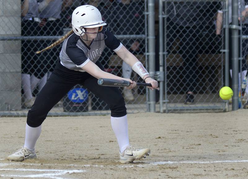 Woodland’s Ella Derossett sets to bunt Tuesday in opening game against Hall