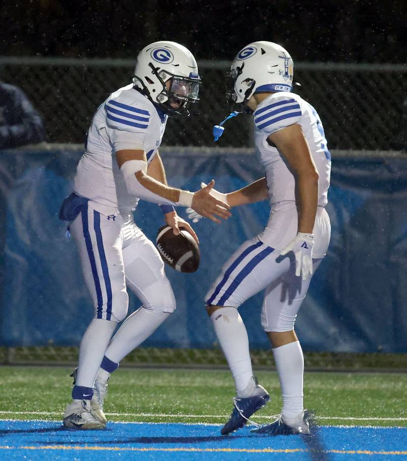 Geneva's Anthony Chahino (12) celebrates his touchdown with Dylan Reyes (5) touchdown during the IHSA Class 6A playoff game Friday November 3, 2023 in Lake Forest.