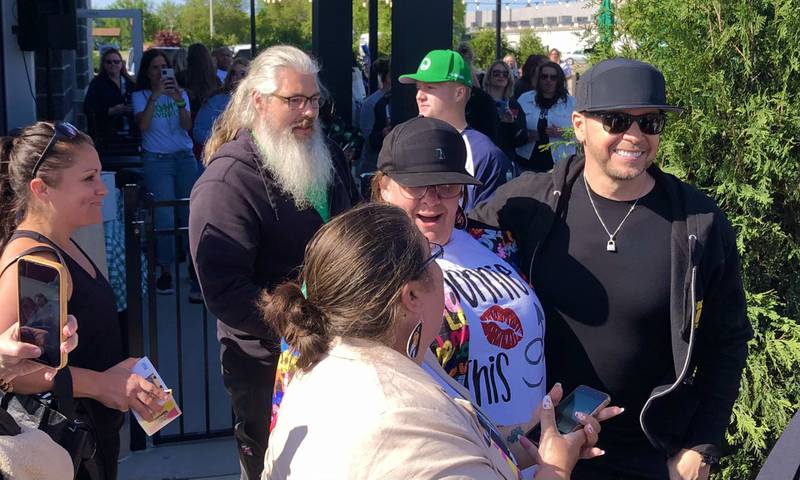 Donnie Wahlberg greets fans at the St. Charles Wahlburgers Thursday afternoon May 25, 2023 during a Wahlcon pre-party event.