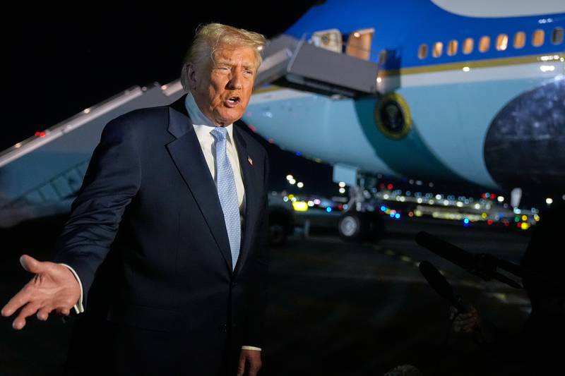 President Donald Trump speaks to reporters before boarding Air Force One at Palm Beach International Airport in West Palm Beach Fla., on his way back to the White House, Sunday, Nov. 16, 2025. (AP Photo/Manuel Balce Ceneta)
